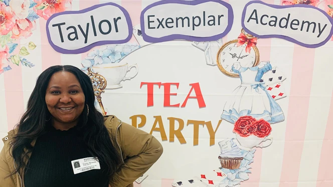 Adult standing next to the Tea Party sign. Adult standing next to the Tea Party sign.