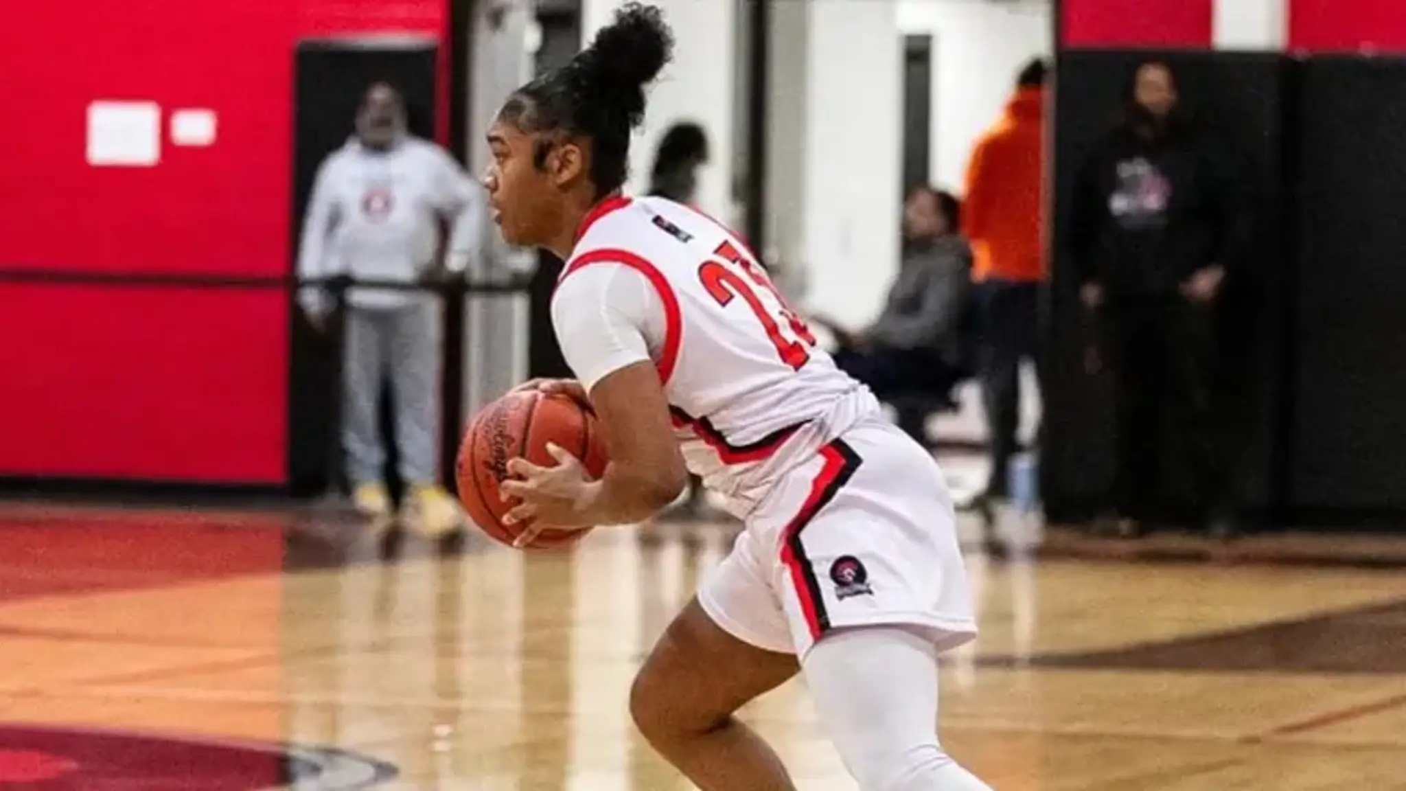 Teen girl playing basketball