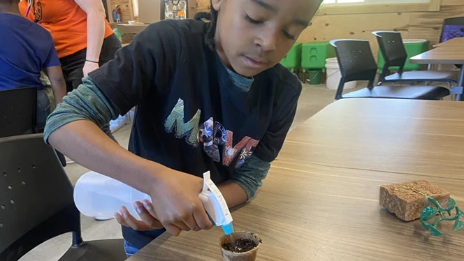 River City student planting food.
