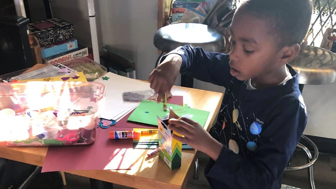 Student making Valentine's card