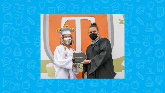 Woman being handed her diploma. Woman being handed her diploma.
