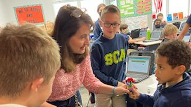 Teacher working with children.