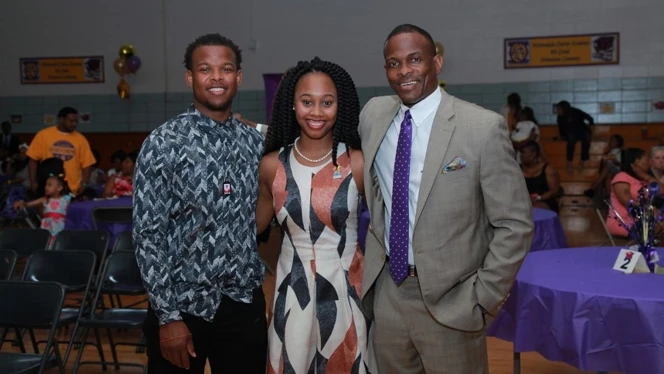 Three people smiling. Three people smiling.