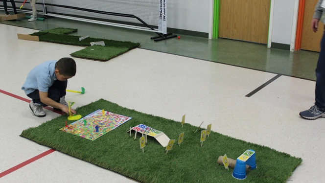 student building his mini golf course