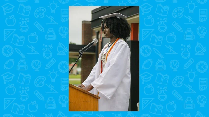 student speaking to graduates