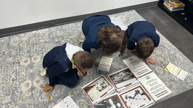 Students looking at old pictures.