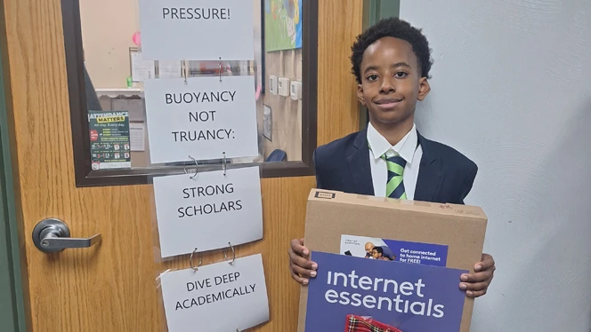 Student with laptop.