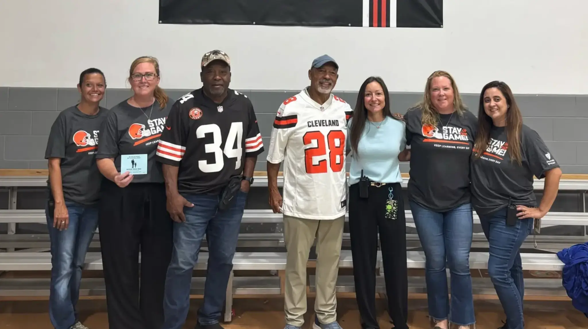 a group of people standing in a row