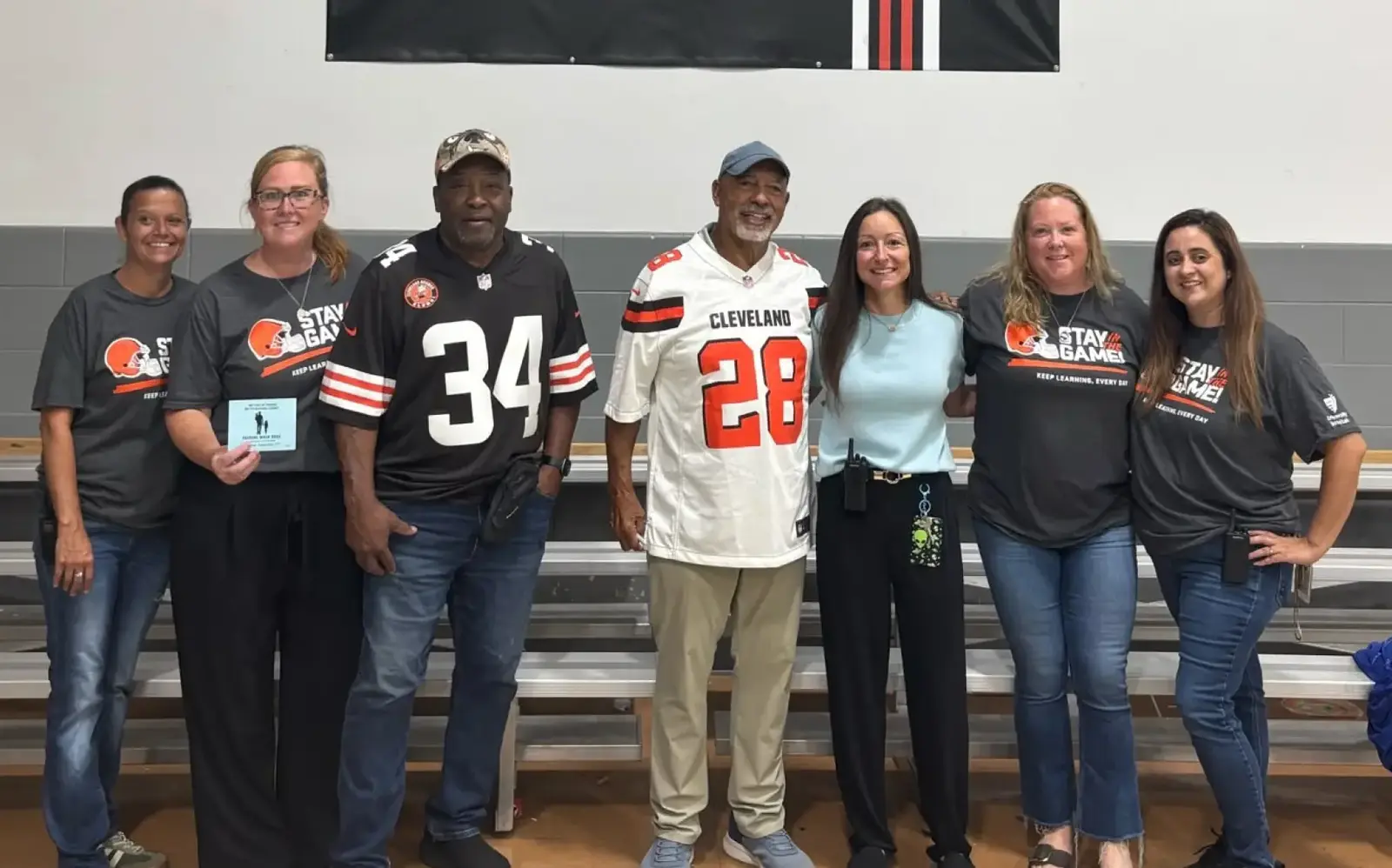 a group of people standing in a row