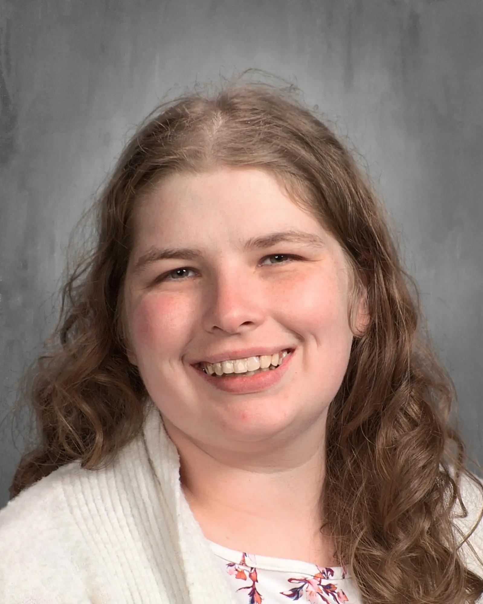 a woman with long hair smiling