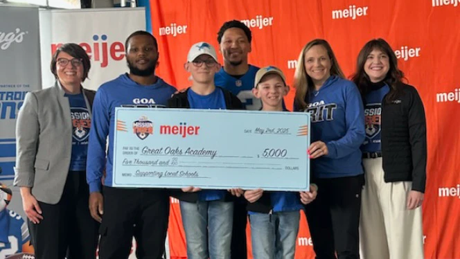 K-12 School in Center Line: Center Line and Great Oaks accept a donation towards middle school athletics.