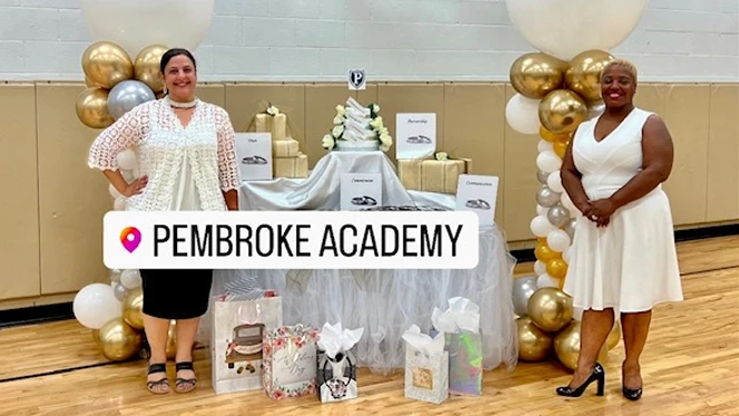 Teachers posing with their display