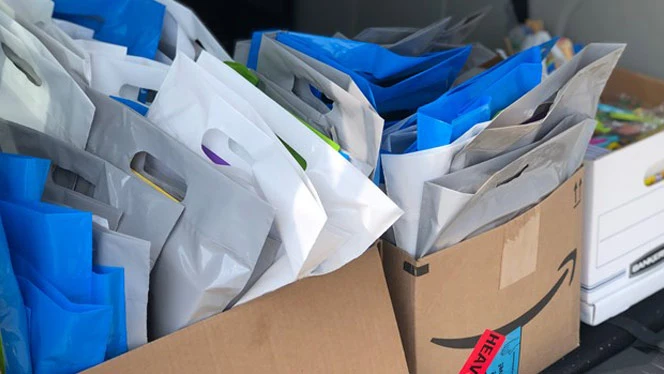 A box filled with goodie bags. A box filled with goodie bags.