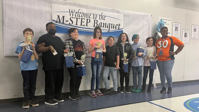 Students holding gift bags