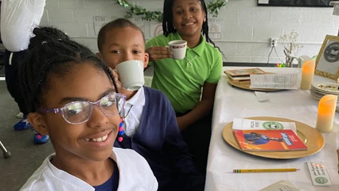 Students with tea and books.