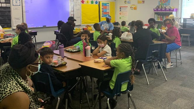 Grandparents and students in a classroom. Grandparents and students in a classroom.
