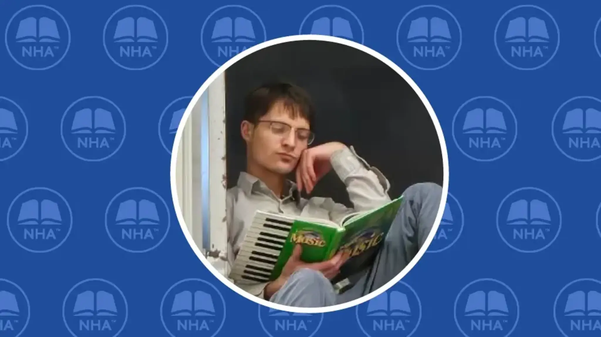 a man sitting on the floor reading a book