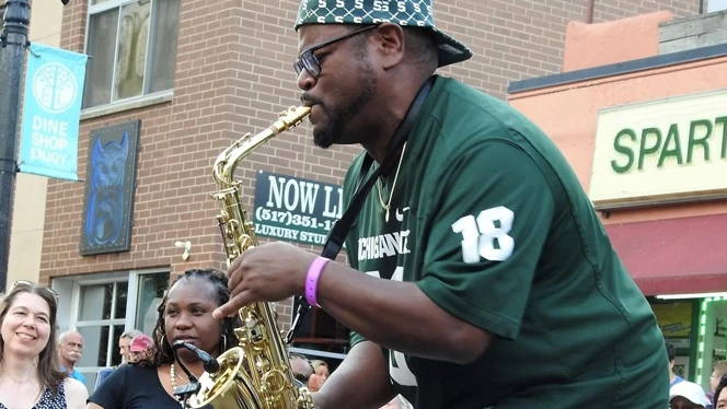 Page playing saxophone.