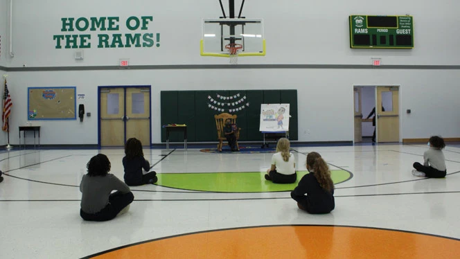 East Arbor students listening to a book reading