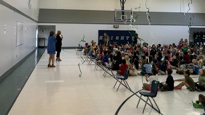 Sierra Anthony speaking to a crowd of students.