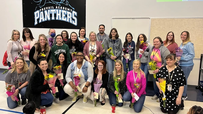 Teachers holding bouquets