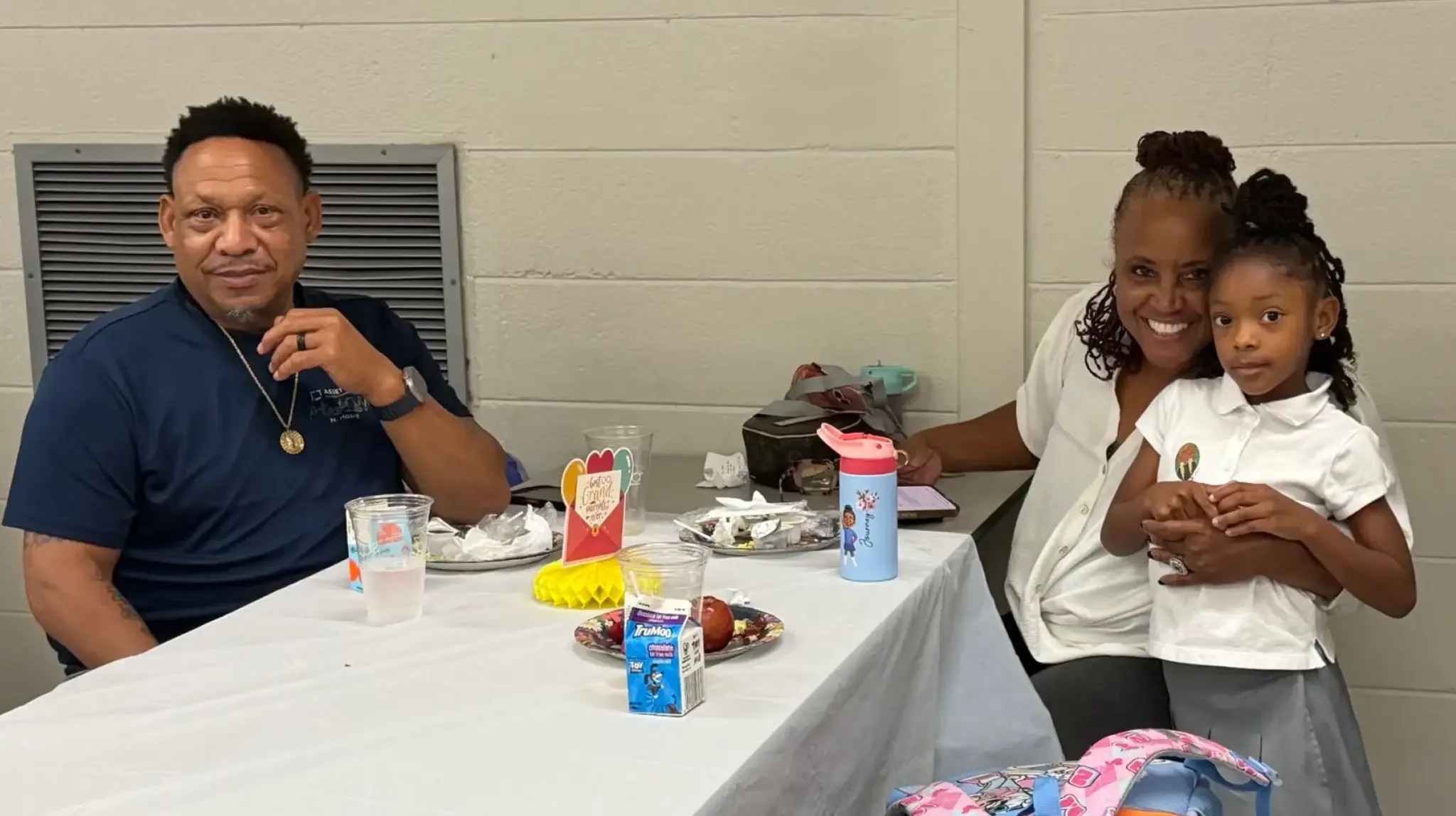 a man and woman sitting at a table