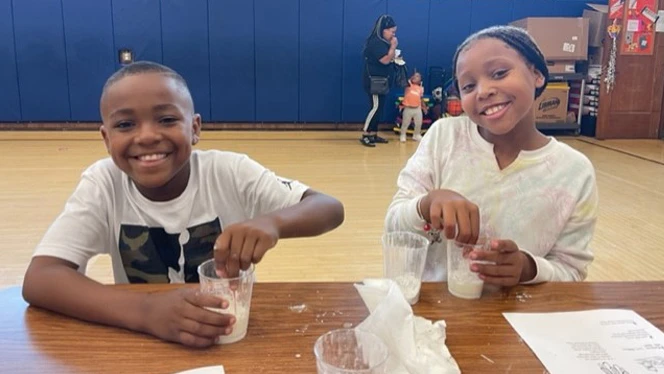 Students making slime at the Science Night. Students making slime at the Science Night.