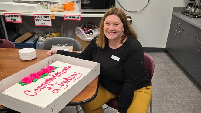 K-8 School in Grand Rapids MI: Ms. Lautenbach with a celebratory cake