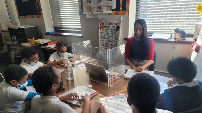 Teacher with students
