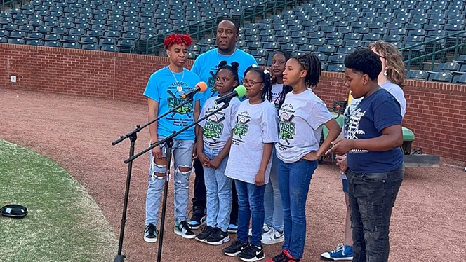 K-8 School in Greensboro: Gate City Charter Academy choir sang the National Anthem at the Greensboro Grasshoppers minor league baseball game.