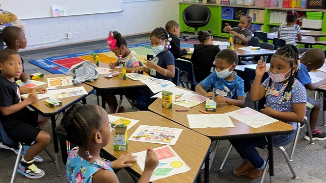 Detroit Merit kindergarteners enjoy a snack