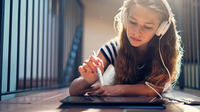 Girl writing on tablet. Girl writing on tablet.