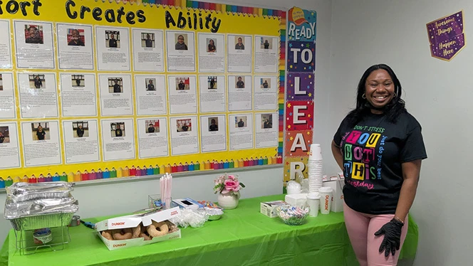 K-8 School in St. Albans: Riverton families help serve food to students before testing at Riverton Street Charter School.