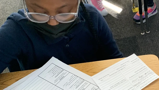 student working on a worksheet
