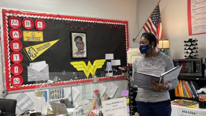 Woman presenting to her class. Woman presenting to her class.
