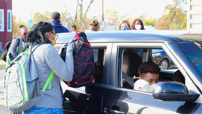 Detroit Enterprise Students receive donated backpacks from Founder's Brewery