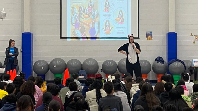 McCormick reading her book to Vista students