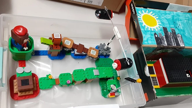 Lego Mario on a built Lego set. Lego Mario on a built Lego set.