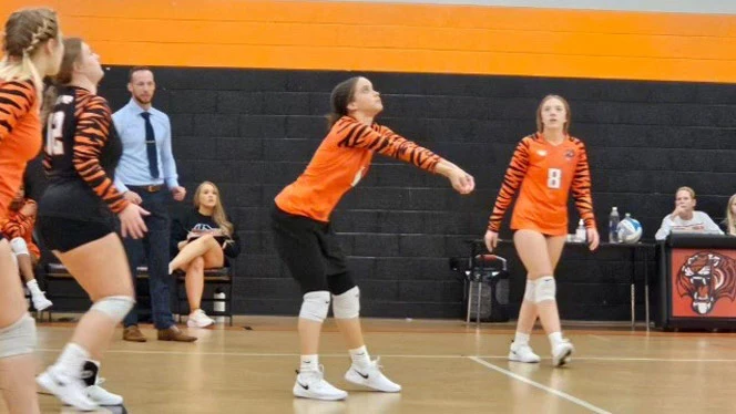 Taylor Prep graduate, Brown, playing volleyball