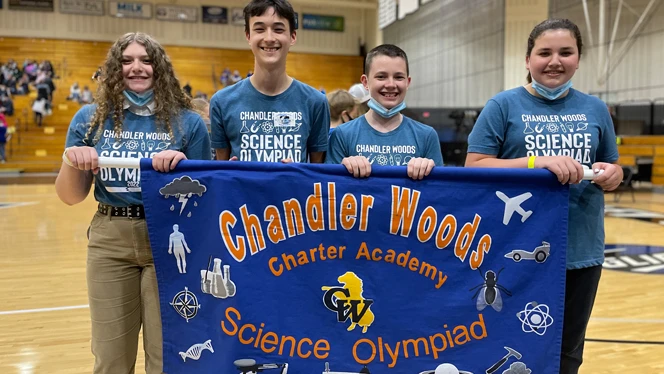 Chandler Woods students holding banner