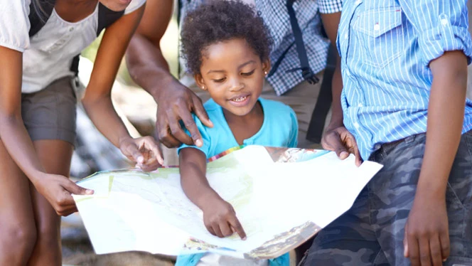 Child reading a map