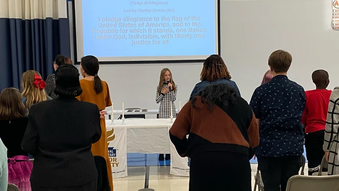 Girl reciting the Pledge of Allegiance to class. Girl reciting the Pledge of Allegiance to class.