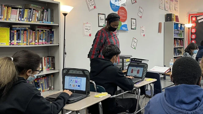 Students learning on their computers. Students learning on their computers.