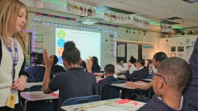 K-8 School in Southfield: Ms. Winter, a fifth-grade teacher at Laurus Academy, teaches her math class.