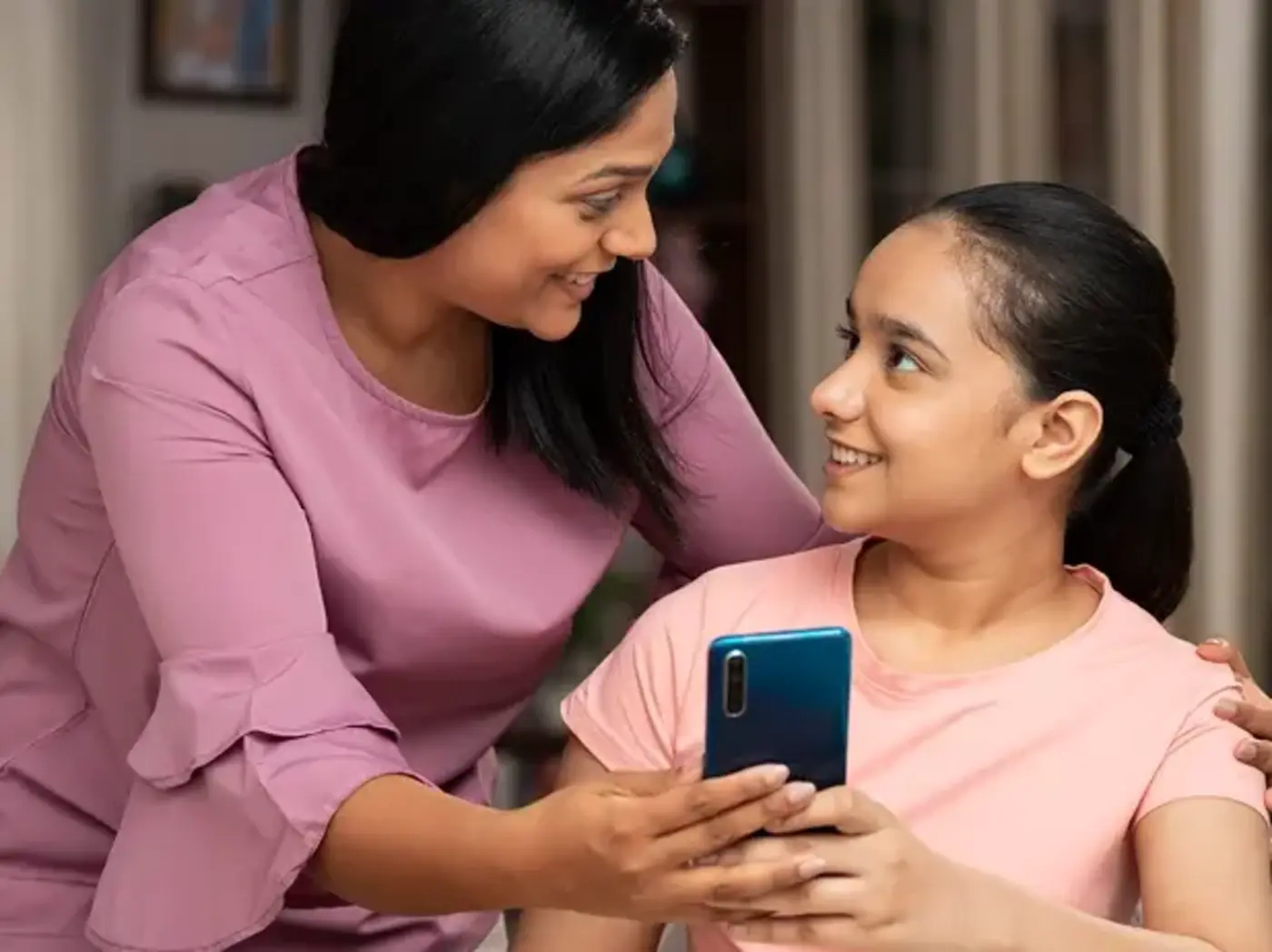 Mom and student looking at phone