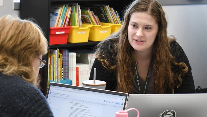 Ms. Warner talking to another teacher