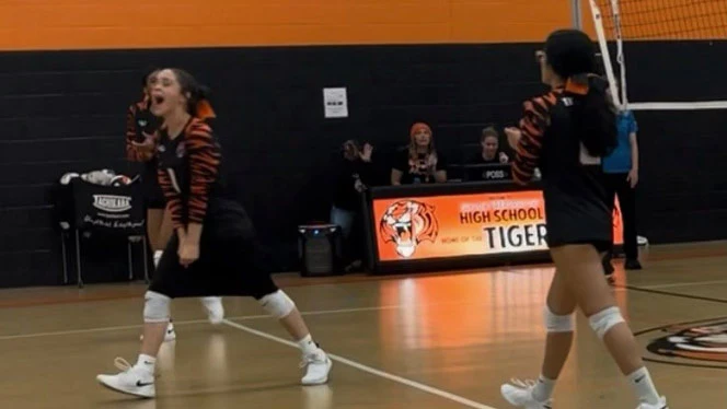 Taylor Prep graduate, Brown, playing volleyball