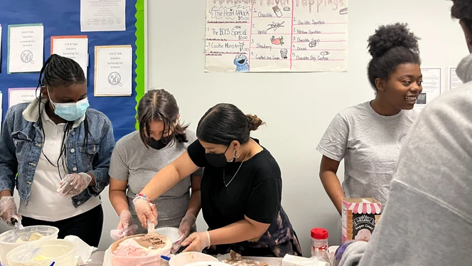 student scooping ice cream