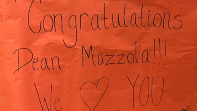 A sign congratulating Ninfa Mazzola. A sign congratulating Ninfa Mazzola.