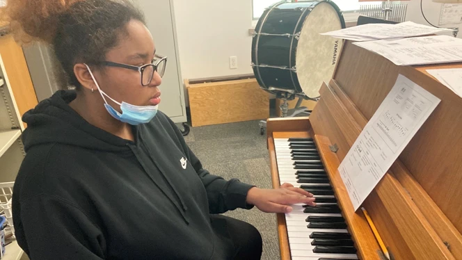 Metro student practicing piano